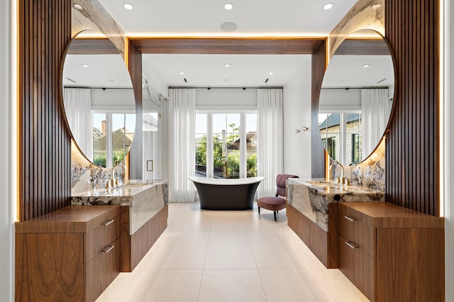 3649 Chevy Chase Dr, Houston, TX 77019 - bathroom featuring a soaking tub, vanity, recessed lighting, and tile patterned floors