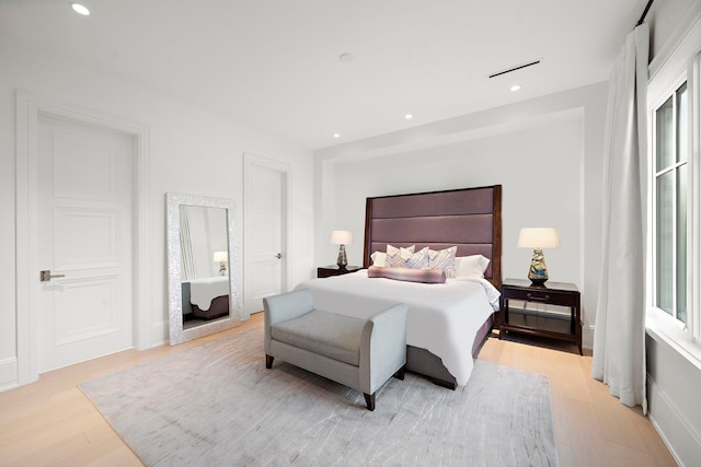 3649 Chevy Chase Dr, Houston, TX 77019 - bedroom with light wood finished floors and recessed lighting