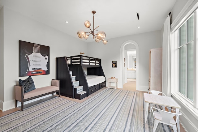 3649 Chevy Chase Dr, Houston, TX 77019 - bedroom with arched walkways, recessed lighting, a chandelier, and ensuite bath