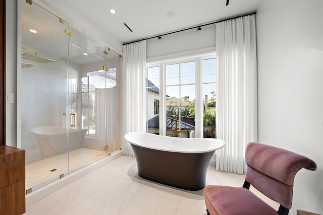 3649 Chevy Chase Dr, Houston, TX 77019 - bathroom with a freestanding tub, a shower stall, recessed lighting, and marble finish flooring