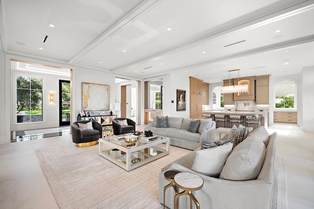 3649 Chevy Chase Dr, Houston, TX 77019 - living area featuring arched walkways, light tile patterned floors, plenty of natural light, and recessed lighting
