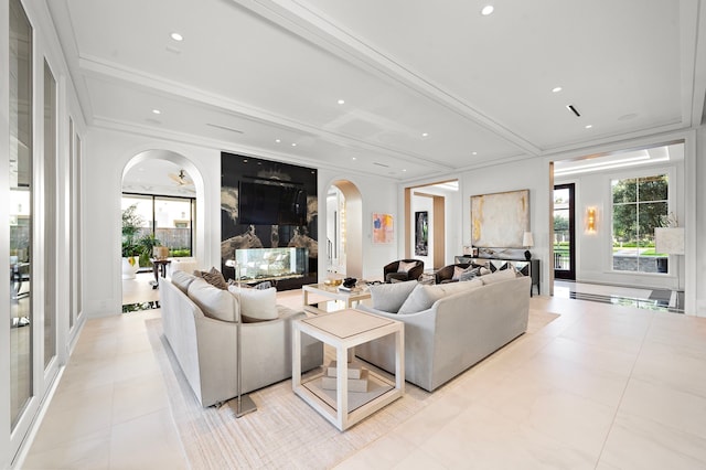 3649 Chevy Chase Dr, Houston, TX 77019 - living room with arched walkways, recessed lighting, plenty of natural light, ornamental molding, and light tile patterned floors