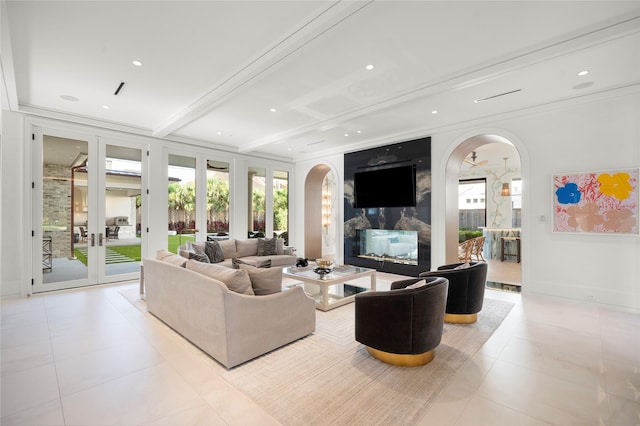 3649 Chevy Chase Dr, Houston, TX 77019 - living area featuring arched walkways, french doors, tile patterned floors, recessed lighting, and beamed ceiling