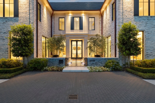 3649 Chevy Chase Dr, Houston, TX 77019 - property entrance featuring a gate, french doors, and brick siding