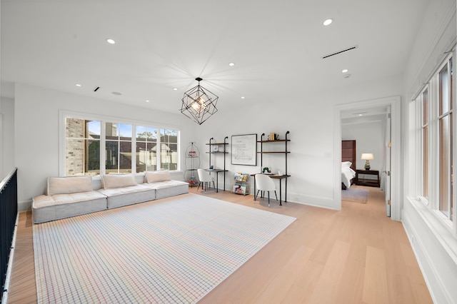3649 Chevy Chase Dr, Houston, TX 77019 - living area featuring light wood finished floors, recessed lighting, and a chandelier