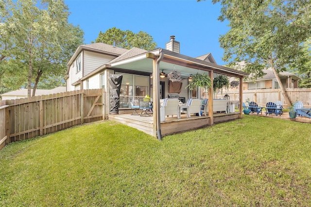 3829 Evergreen Way, Montgomery, TX 77356 - rear view of house featuring a ceiling fan, a chimney, a fenced backyard, and a wooden deck
