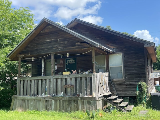 408 Bay Oaks Dr, La Porte, TX 77571 - back of house featuring covered porch and cooling unit