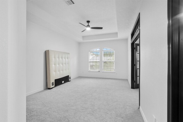 2523 Watts St, Houston, TX 77030 - spare room featuring carpet, a ceiling fan, and a tray ceiling