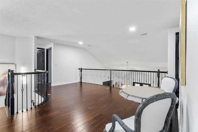 2523 Watts St, Houston, TX 77030 - office featuring wood finished floors, vaulted ceiling, recessed lighting, and a textured ceiling