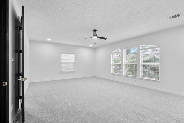 2523 Watts St, Houston, TX 77030 - empty room featuring ceiling fan, carpet, a textured ceiling, and recessed lighting