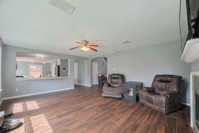 16410 Great Frst, Humble, TX 77346 - living area featuring wood finished floors, ceiling fan, and arched walkways