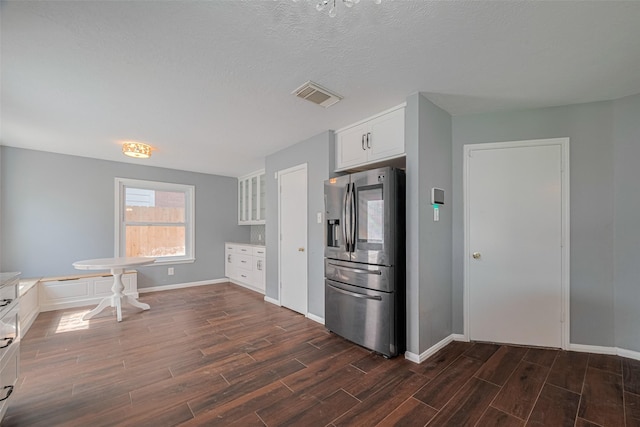 16410 Great Frst, Humble, TX 77346 - kitchen featuring stainless steel fridge with ice dispenser, dark wood finished floors, white cabinetry, glass insert cabinets, and light countertops
