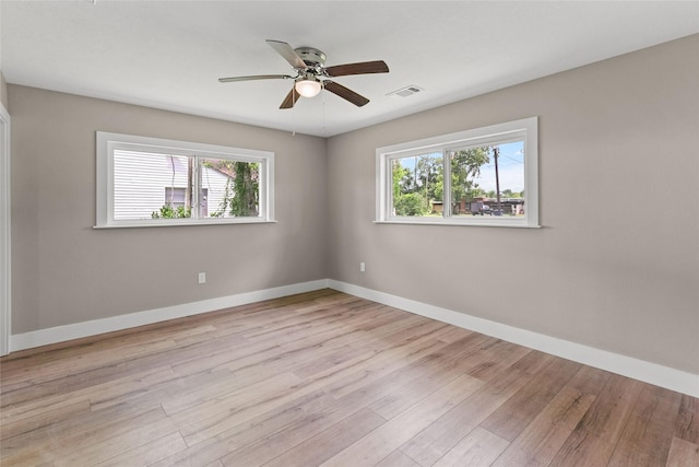 318 Primrose Rd, Jones Creek, TX 77541 - unfurnished room featuring plenty of natural light, a ceiling fan, and light wood-style floors