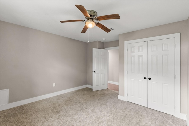 318 Primrose Rd, Jones Creek, TX 77541 - unfurnished bedroom featuring light colored carpet, a closet, and a ceiling fan