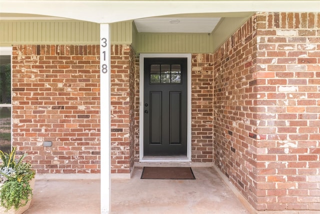 318 Primrose Rd, Jones Creek, TX 77541 - doorway to property featuring brick siding