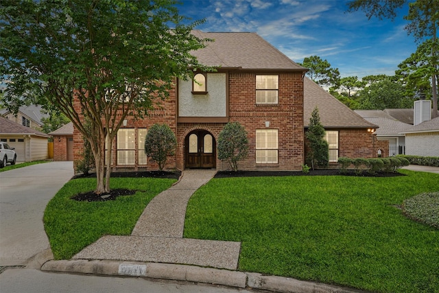 6711 Walton Heath Dr, Houston, TX 77069 - view of front of house featuring brick siding, a front yard, and roof with shingles