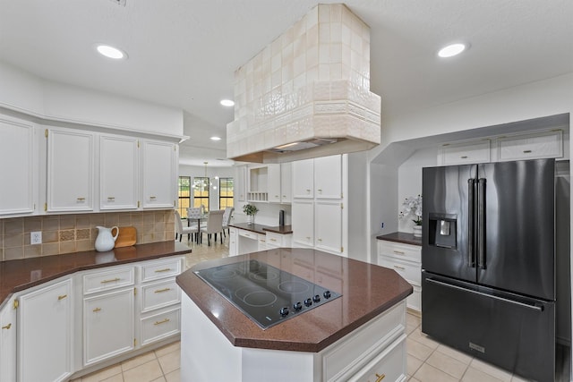 6711 Walton Heath Dr, Houston, TX 77069 - kitchen featuring black appliances, dark countertops, light tile patterned floors, white cabinets, and recessed lighting
