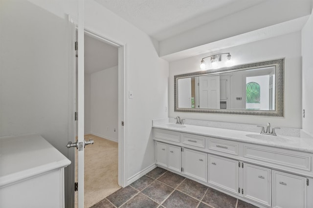 6711 Walton Heath Dr, Houston, TX 77069 - full bathroom featuring double vanity and a textured ceiling