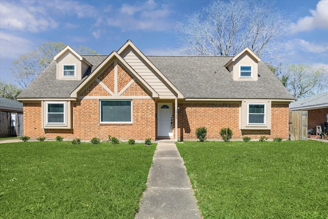 5730 Cartagena St, Houston, TX 77035 - view of front of house with brick siding, a front lawn, and a shingled roof