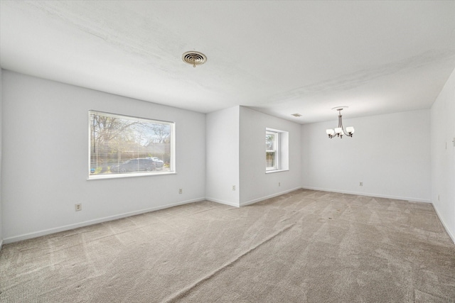 5730 Cartagena St, Houston, TX 77035 - carpeted spare room with a chandelier and baseboards