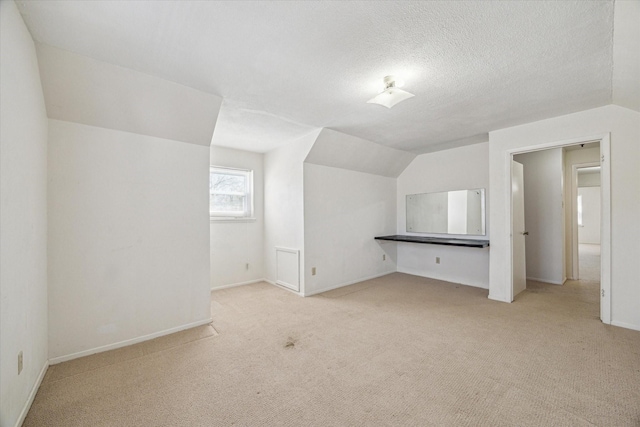 5730 Cartagena St, Houston, TX 77035 - additional living space featuring carpet flooring and vaulted ceiling