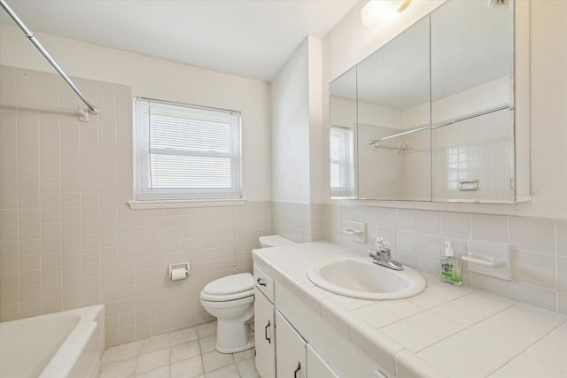 5730 Cartagena St, Houston, TX 77035 - bathroom featuring tile walls, vanity, tile patterned flooring, and shower / tub combination