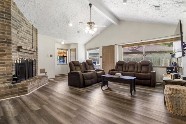 40 Crestbriar Ct, Baytown, TX 77521 - living room featuring a textured ceiling, a ceiling fan, wood finished floors, a brick fireplace, and high vaulted ceiling