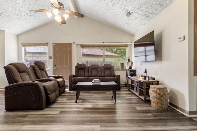 40 Crestbriar Ct, Baytown, TX 77521 - living room with a textured ceiling, ceiling fan, lofted ceiling, wood finished floors, and healthy amount of natural light