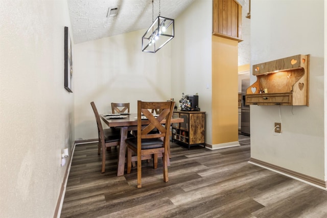 40 Crestbriar Ct, Baytown, TX 77521 - dining area with dark wood-type flooring and a textured ceiling
