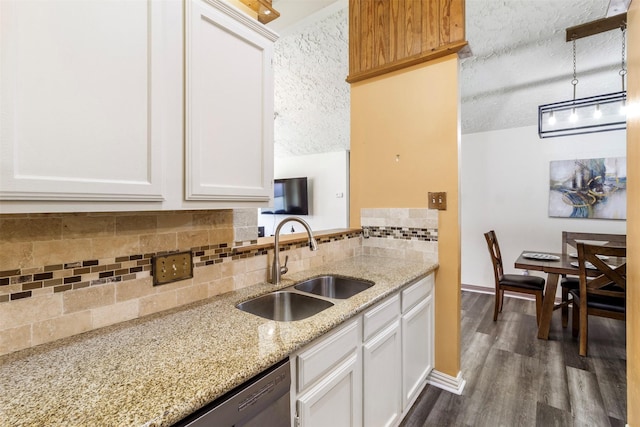 40 Crestbriar Ct, Baytown, TX 77521 - kitchen with a textured ceiling, backsplash, light stone counters, and white cabinetry