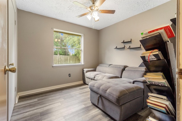 40 Crestbriar Ct, Baytown, TX 77521 - sitting room featuring a ceiling fan, a textured ceiling, and wood finished floors