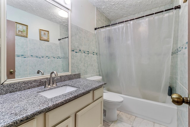 40 Crestbriar Ct, Baytown, TX 77521 - full bathroom featuring tile walls, vanity, shower / tub combo with curtain, a textured ceiling, and marble look tiles