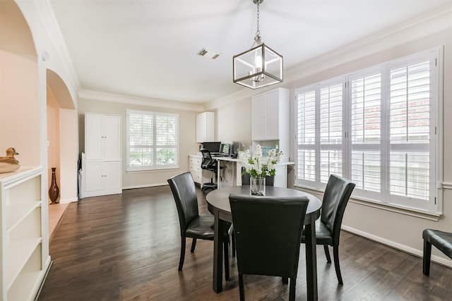 11802 Laurel Meadow Dr, Tomball, TX 77377 - dining space with arched walkways, crown molding, dark wood-style flooring, and a chandelier