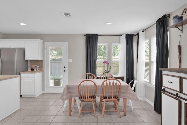 155 Fairwind Trail Dr, Conroe, TX 77385 - dining space featuring light tile patterned floors and recessed lighting