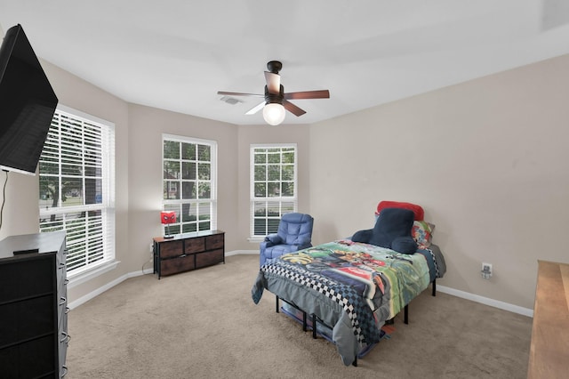 155 Fairwind Trail Dr, Conroe, TX 77385 - bedroom with carpet floors and ceiling fan