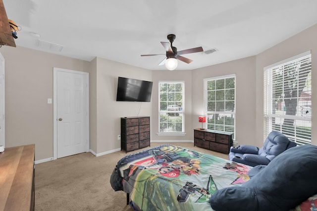 155 Fairwind Trail Dr, Conroe, TX 77385 - bedroom featuring light carpet and a ceiling fan