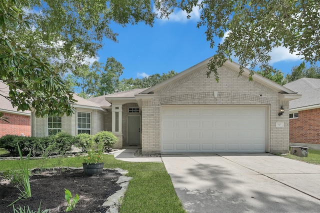 155 Fairwind Trail Dr, Conroe, TX 77385 - ranch-style house featuring brick siding, driveway, and a garage