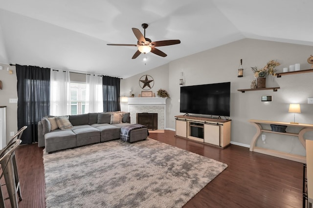 155 Fairwind Trail Dr, Conroe, TX 77385 - living room featuring lofted ceiling, a ceiling fan, a stone fireplace, and wood finished floors