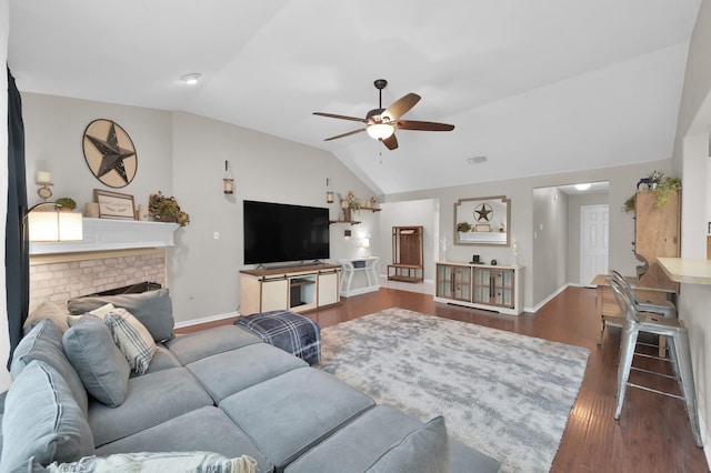 155 Fairwind Trail Dr, Conroe, TX 77385 - living room with lofted ceiling, ceiling fan, wood finished floors, and a brick fireplace