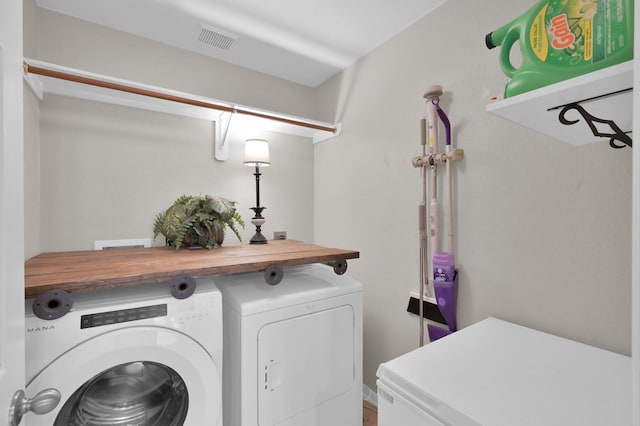 155 Fairwind Trail Dr, Conroe, TX 77385 - laundry area with washing machine and clothes dryer