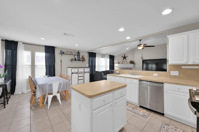 155 Fairwind Trail Dr, Conroe, TX 77385 - kitchen with dishwasher, light countertops, ceiling fan, a kitchen island, and recessed lighting