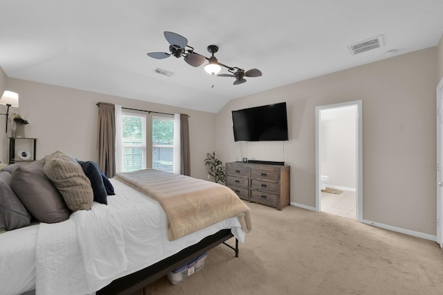155 Fairwind Trail Dr, Conroe, TX 77385 - bedroom with light carpet, vaulted ceiling, ceiling fan, and connected bathroom
