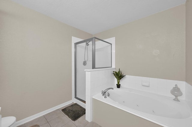 155 Fairwind Trail Dr, Conroe, TX 77385 - full bathroom featuring a shower stall, a tub with jets, and tile patterned flooring