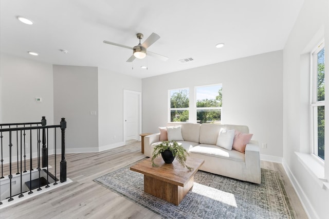7407 Cora St, Houston, TX 77088 - living room with light wood-style floors, a ceiling fan, and recessed lighting