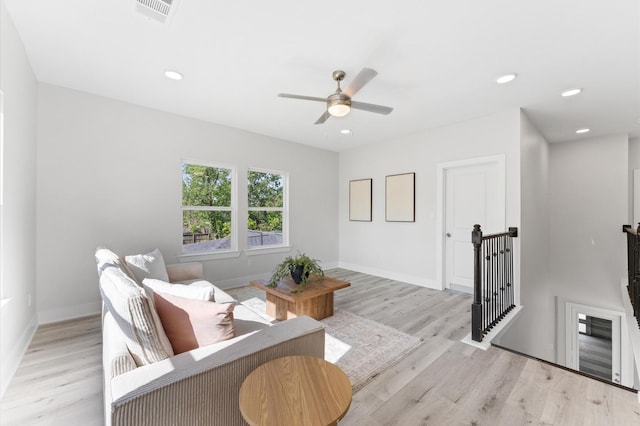 7407 Cora St, Houston, TX 77088 - living area featuring light wood finished floors, ceiling fan, and recessed lighting