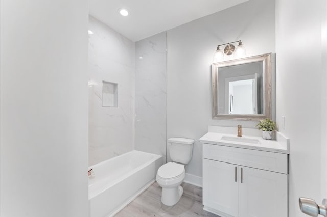 7407 Cora St, Houston, TX 77088 - bathroom with vanity, wood finished floors, bathing tub / shower combination, and recessed lighting