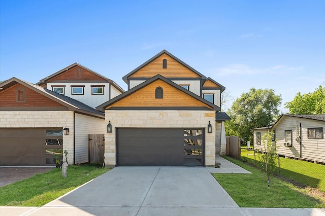 7407 Cora St, Houston, TX 77088 - contemporary home with stone siding, driveway, and an attached garage