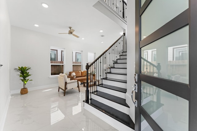 7407 Cora St, Houston, TX 77088 - stairs with ceiling fan, marble tiled flooring, and recessed lighting