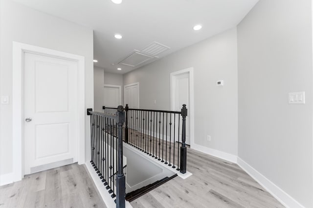 7407 Cora St, Houston, TX 77088 - hallway with attic access, an upstairs landing, wood finished floors, and recessed lighting
