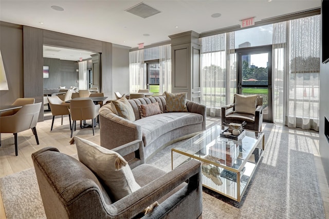 5100 San Felipe St Unit 353, Houston, TX 77056 - living area featuring light wood finished floors, healthy amount of natural light, and crown molding